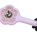 A lavender hand mirror with a flower-shaped back and a Kuromi character